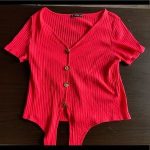 Red shirt with tie in the front